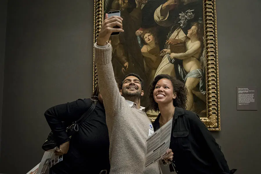 A team takes a scavenger hunt selfie.