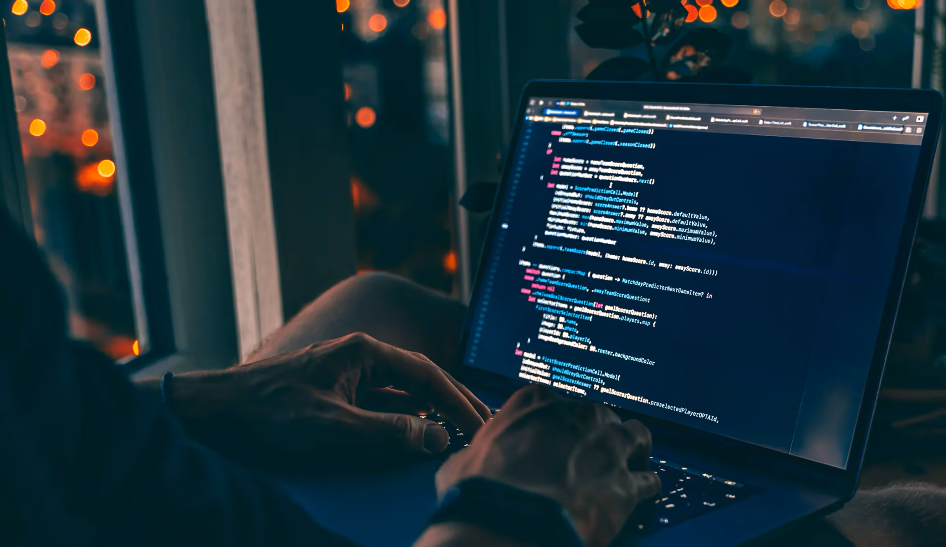hands on a laptop