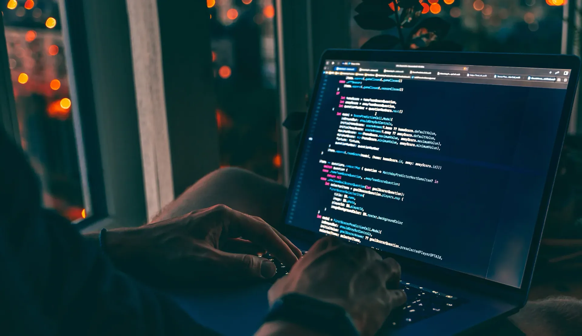 hands on a laptop