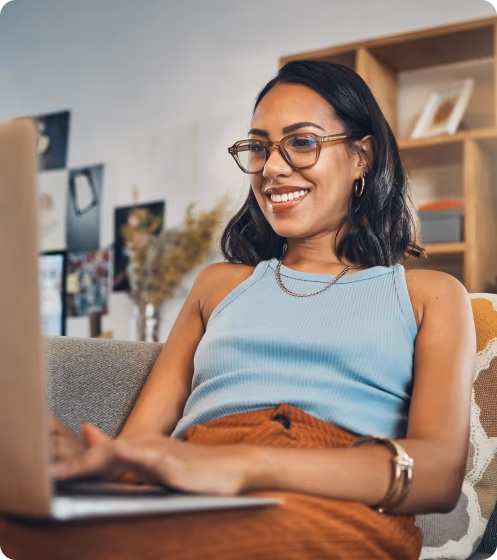 Smiling woman on laptop