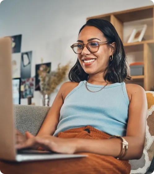 Smiling woman on laptop